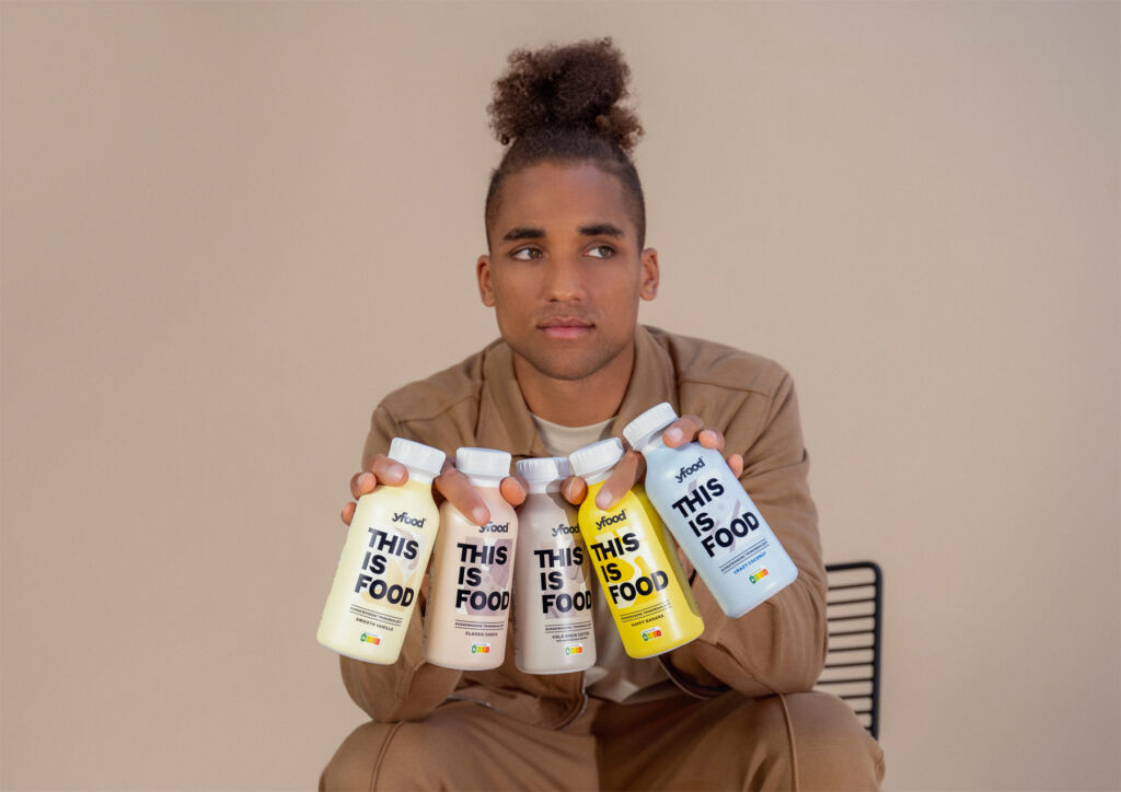 Male model holding the yfood drinks bottles