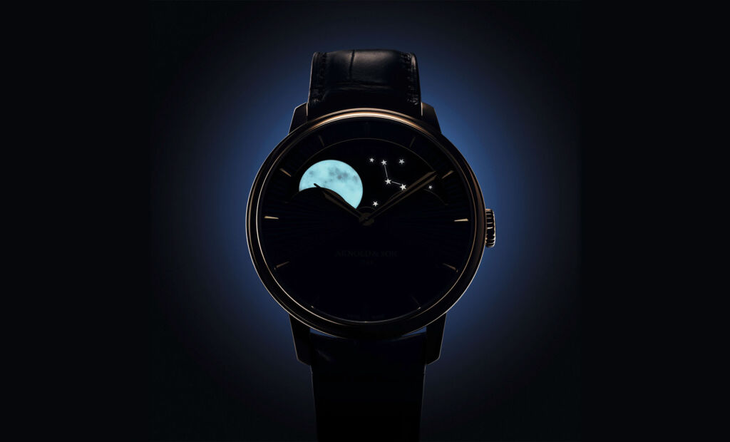 The watch face in the dark clearly showing the moon's detail