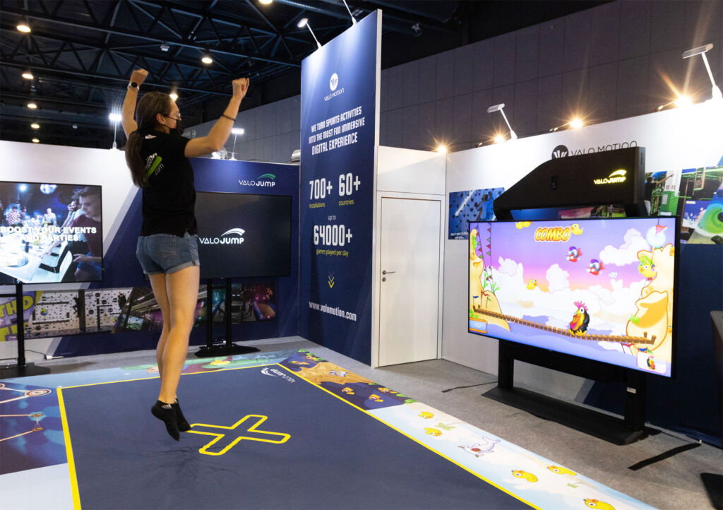A woman trying the interactive trampoline