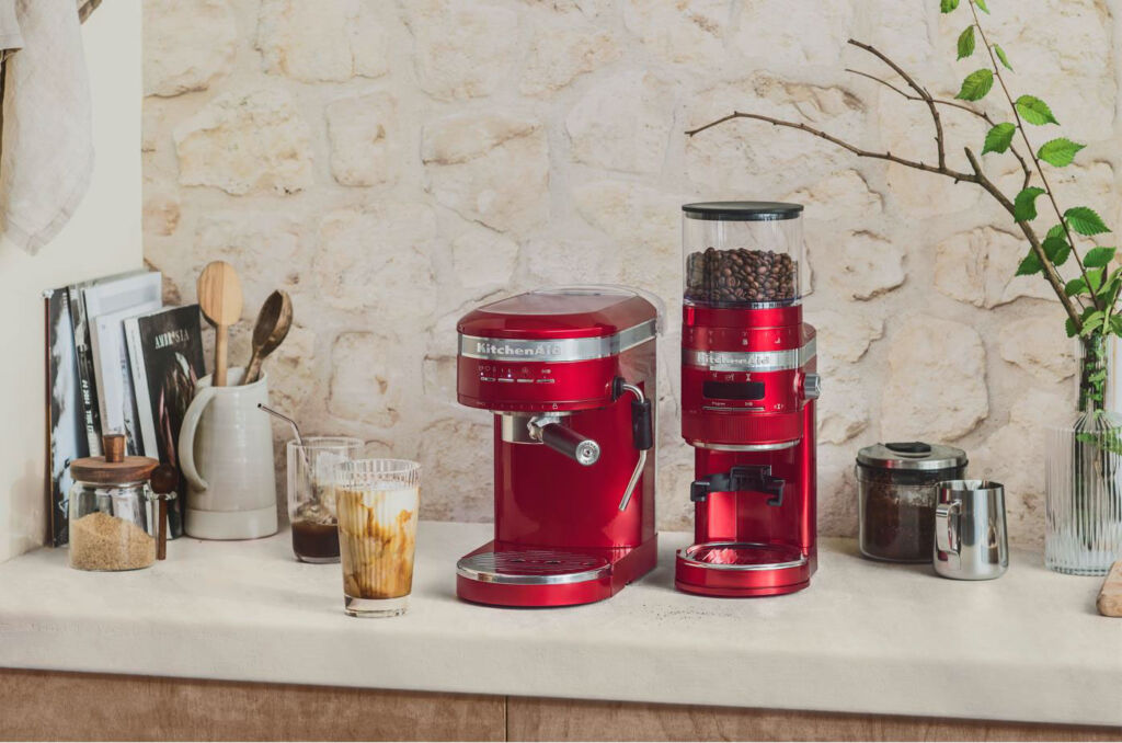 The Coffee Grinder in Candy Apple Red colour next to a matching coloured Espresso machine in the kitchen