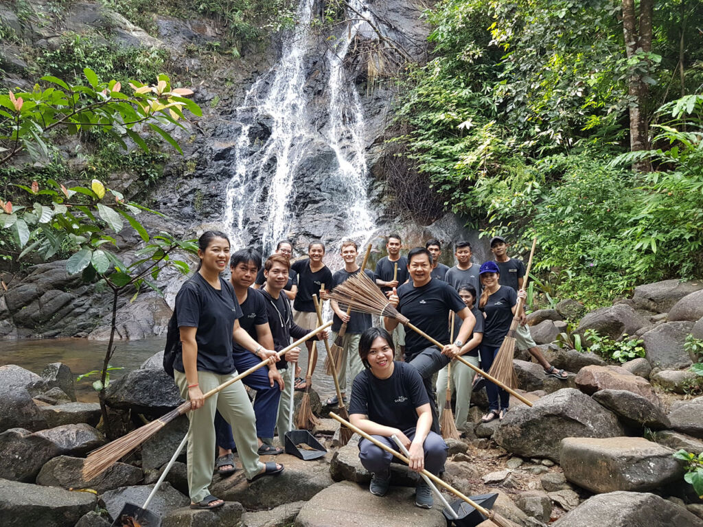 The community support team cleaning up a waterfall
