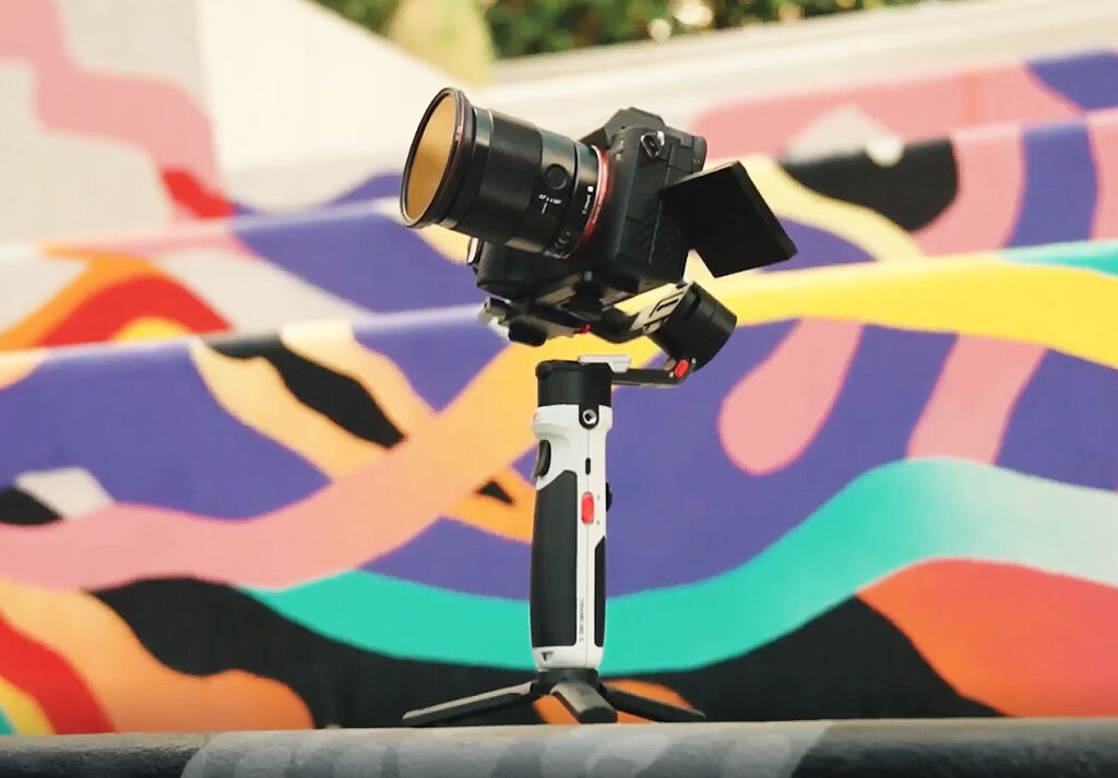 The stabiliser on its tripod with a mirrorless camera atop it