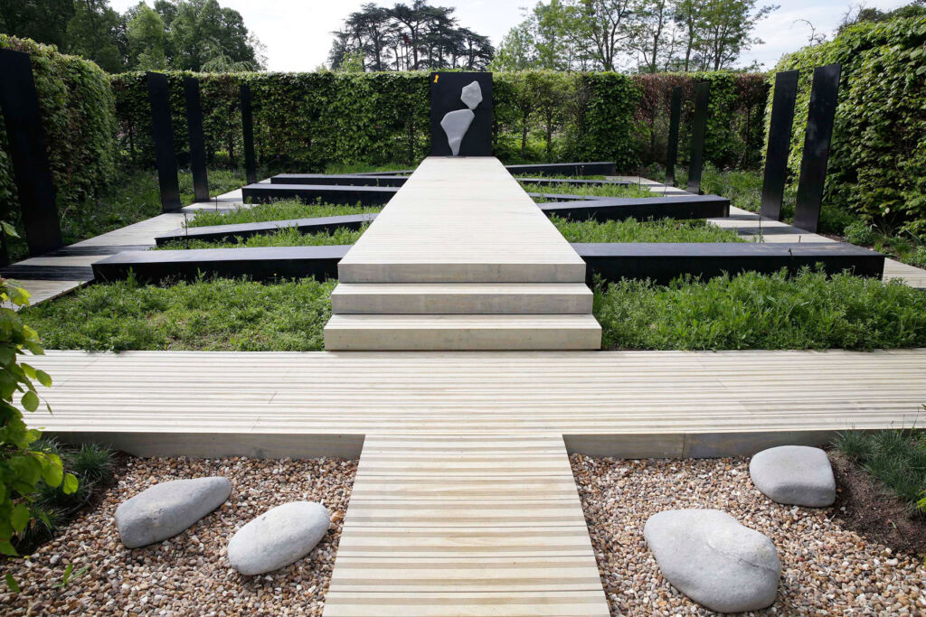 Adrian's Chaumont sculpture in a garden divided by decking