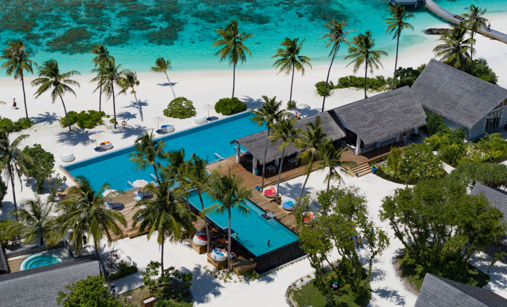 An aerial view of the main pool at Cora Cora Maldives