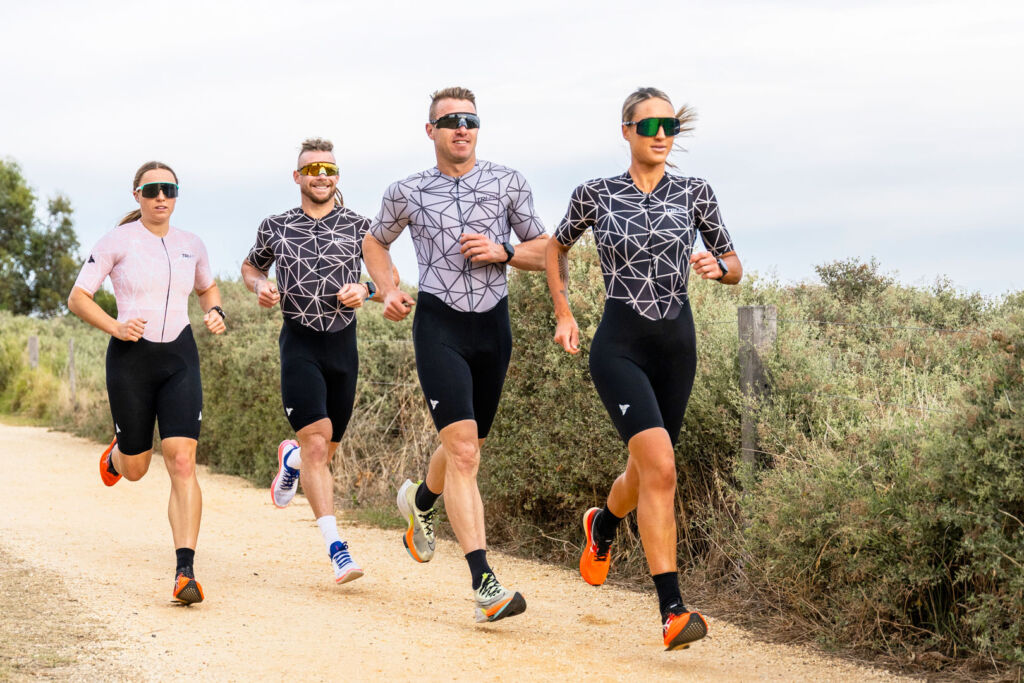Athletes out on a run wearing TRI-FIT suits