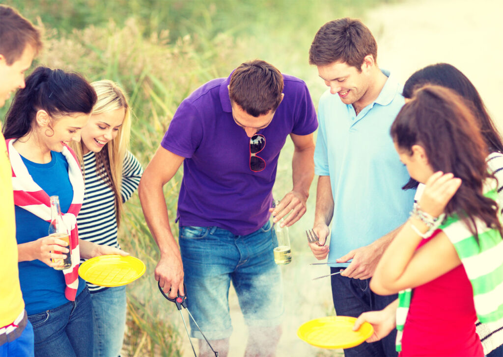 Young people enjoying a BBQ outdoors