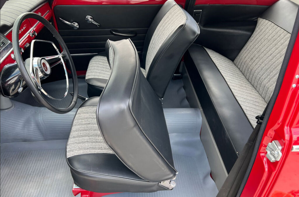 An interior view of the car showing its folding front seats