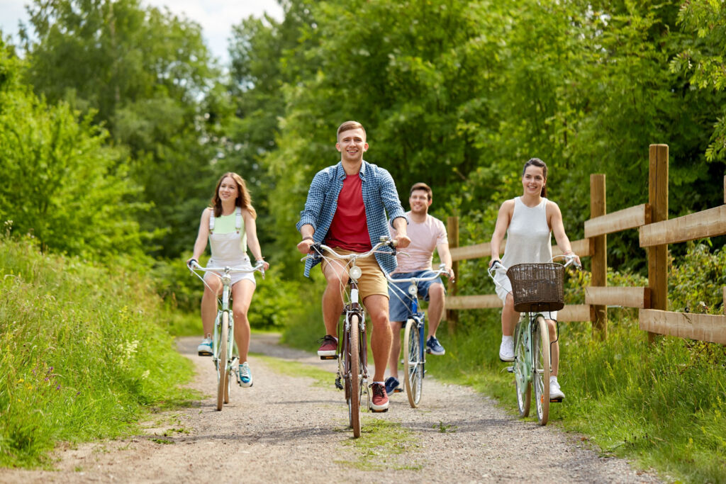 Young people out cycling in the countryside