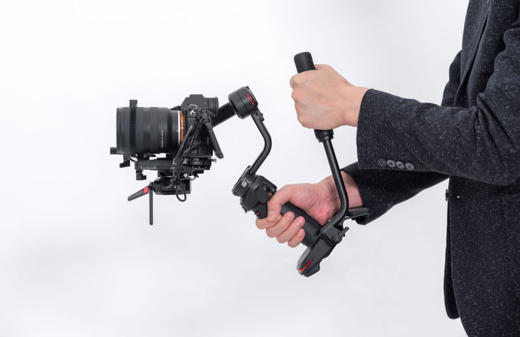 A user holding the newly designed gimbal, which shows the improved ergonomics and comfortable positioning