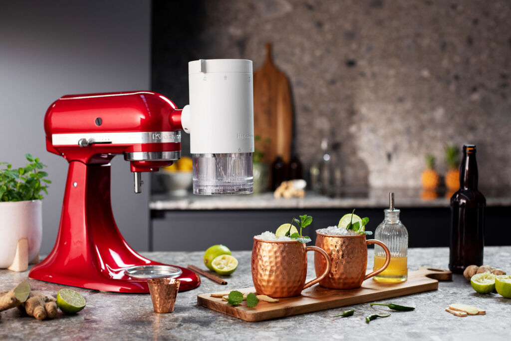 One of the brand's mixers in Candy Apple red using the attachment to make Moscow Mule's