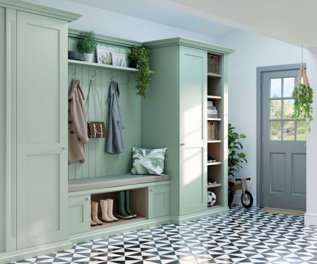 A family boot room in a light green colour