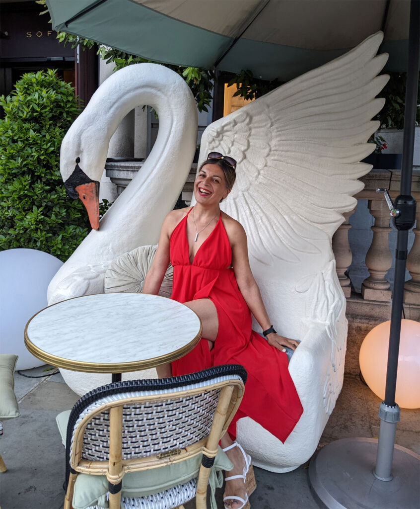 Sabi Phagura sat on the giant swan at Sofitel London St James