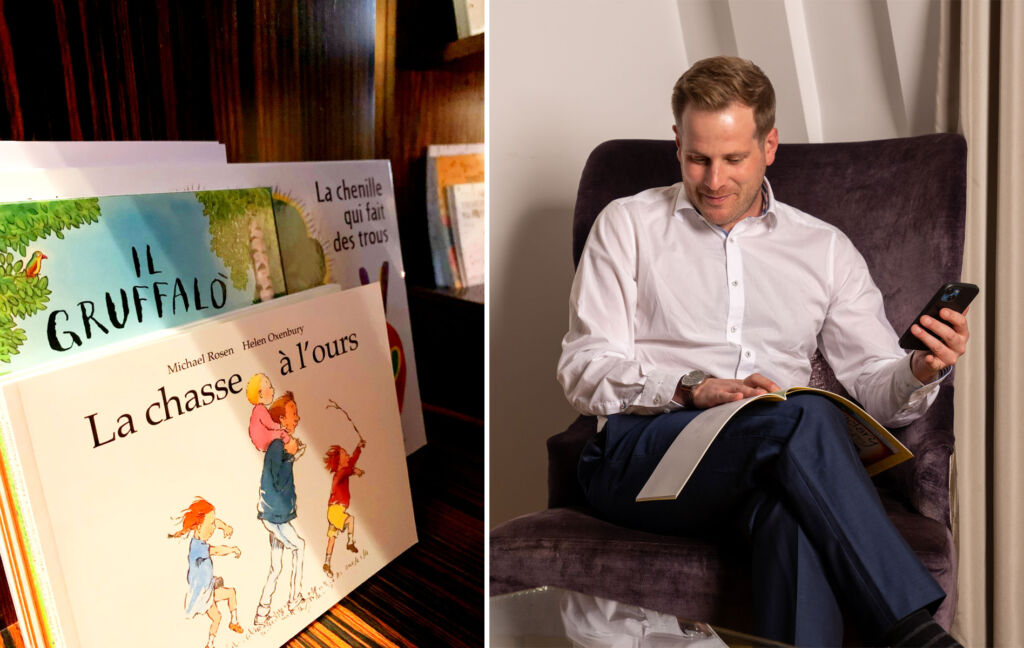 A man reading some of the children's books