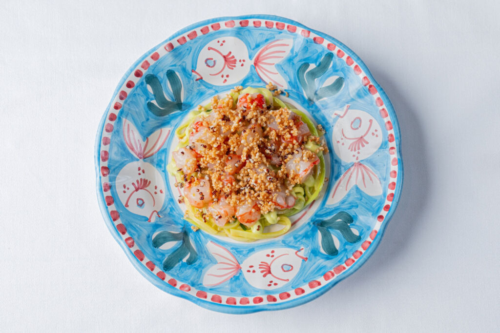 The Gambero Rosso dish on a colourful hand painted plate