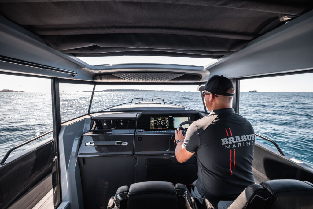 A man piloting or driving the stealthy boat