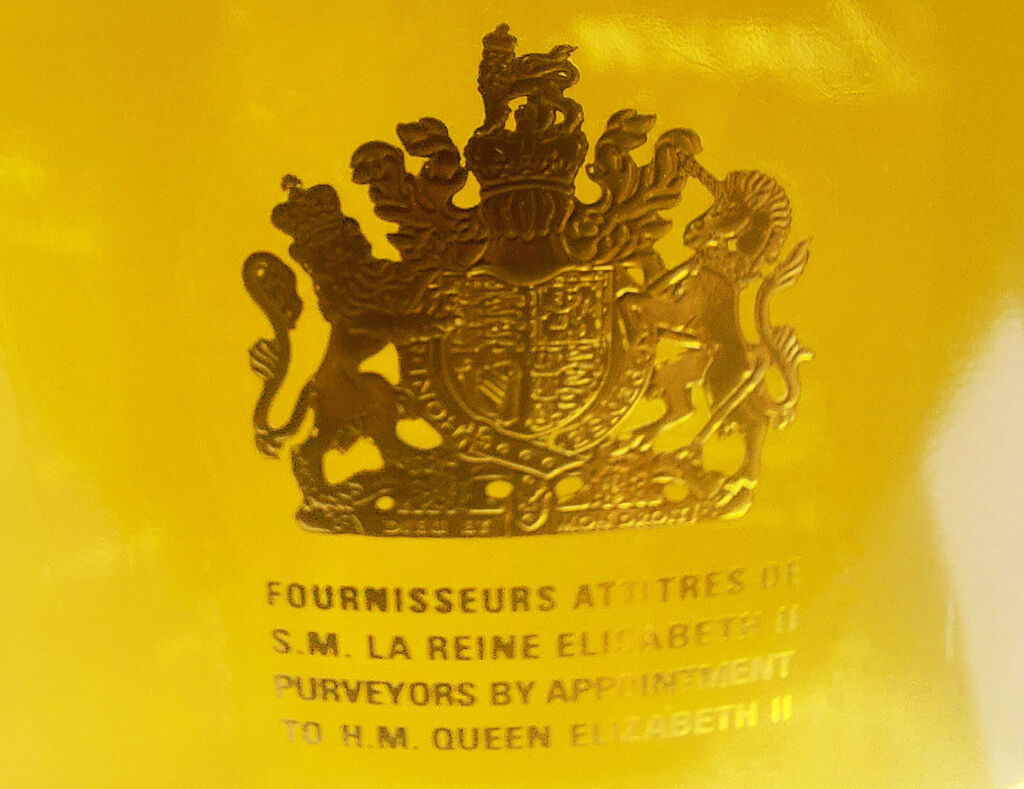 A close up of the gold Royal Warrant label on the bottle