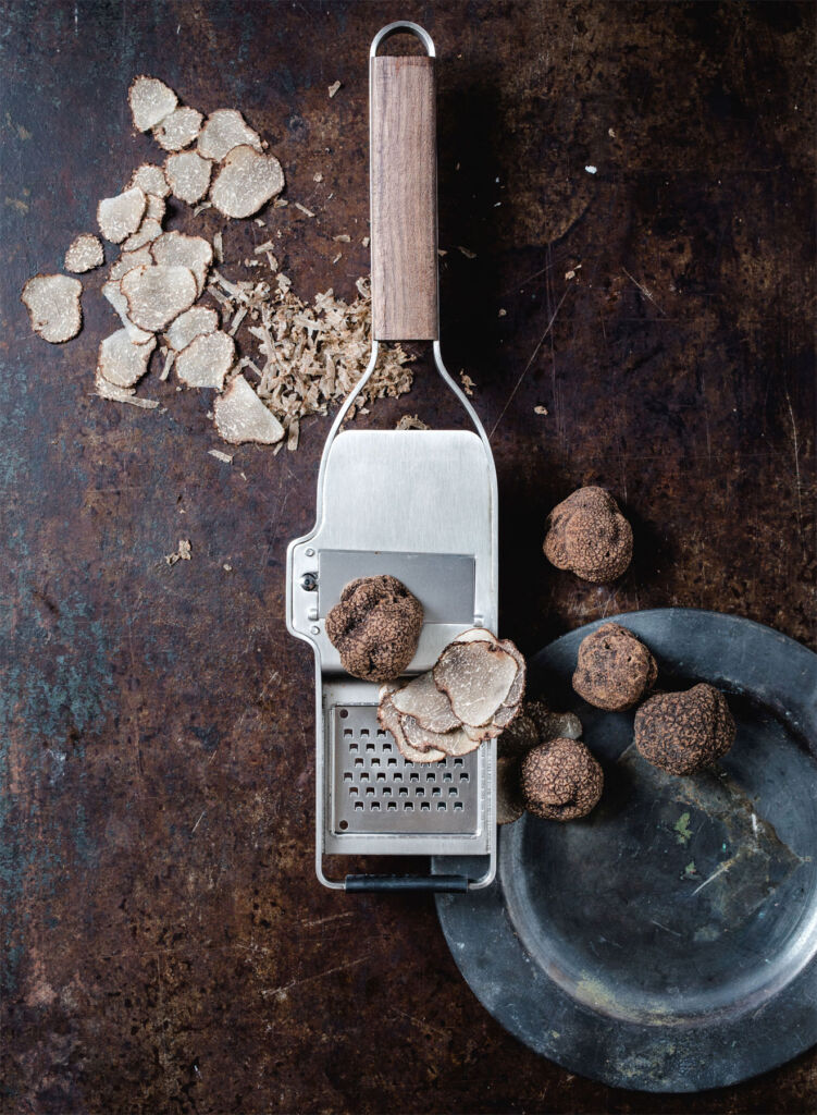 The Truffle tool next to a bowl of sliced truffles