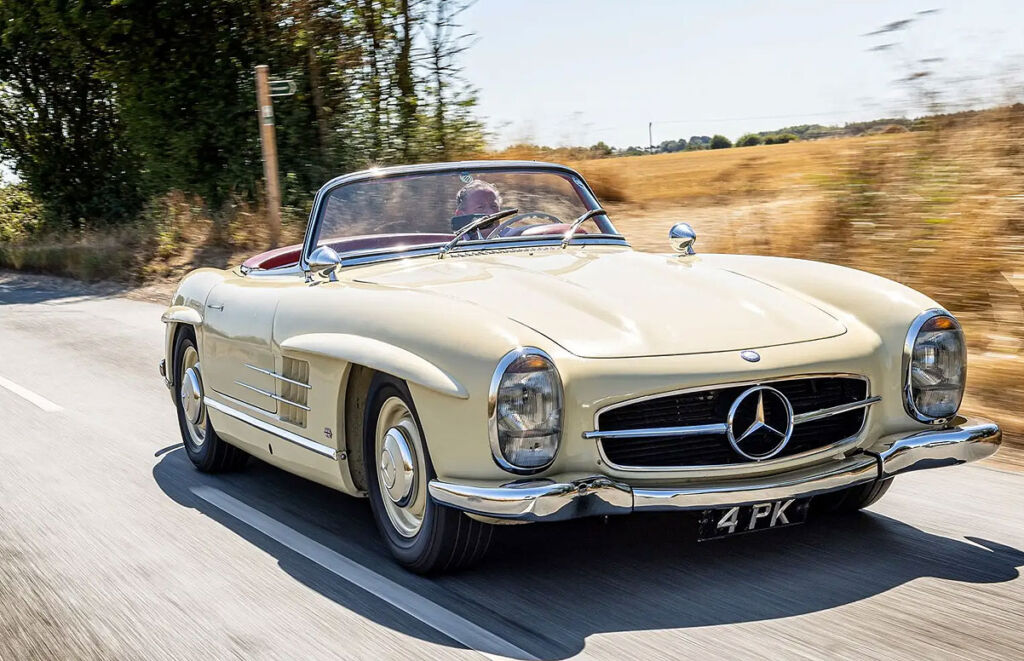 The 1963 Mercedes-Benz 300 SL Roadster being driven on the open road
