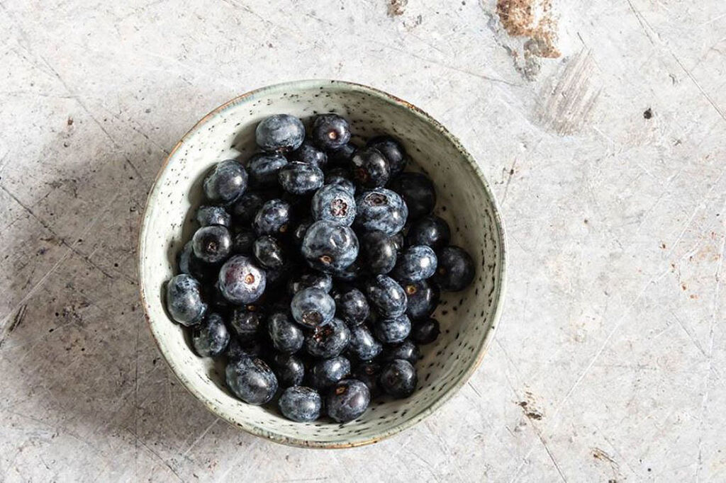A bowl of blueberries viewed from above