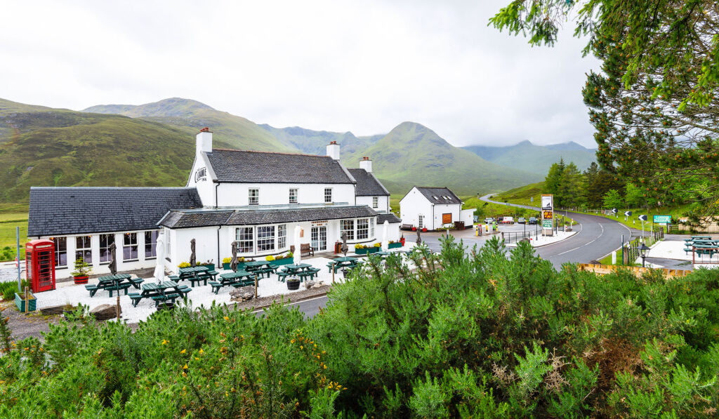 An external view of The Cluanie Inn showing its location in the hills