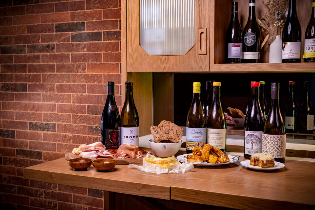 A selection of the wines and foods on a kitchen work surface