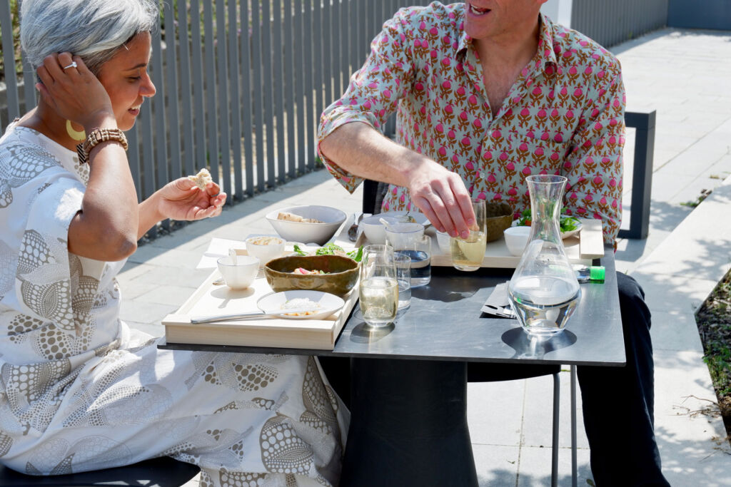 A couple enjoying the food on the terrace