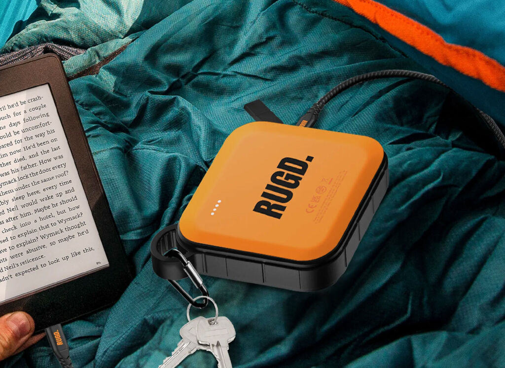 The power brick next to a kindle and a set of door kets