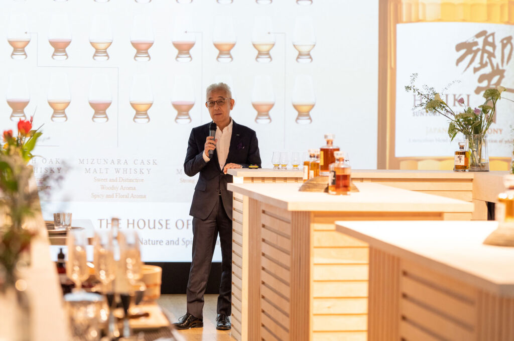 Shinji Fukuyo on the stage talking to guests at the tasting