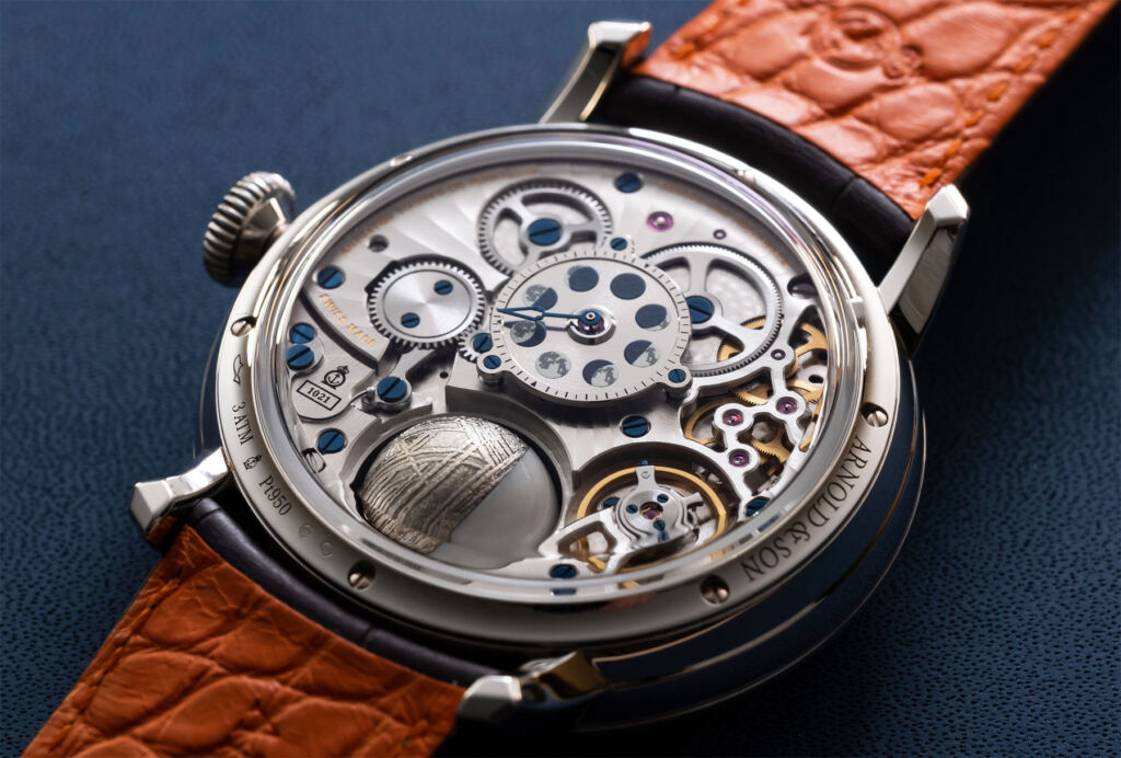 An image showing the rear of the timepiece and its mechanical movement