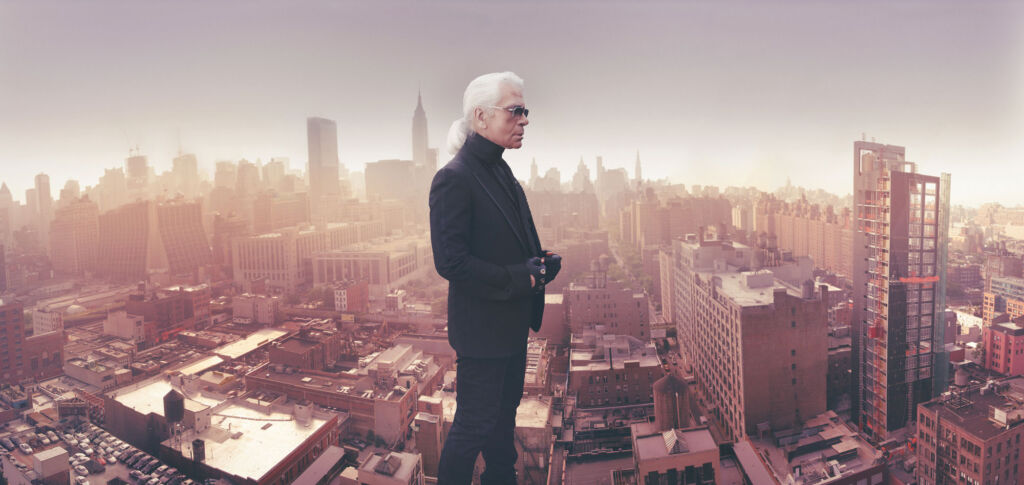 A photograph of Karl Lagerfeld on top of a building