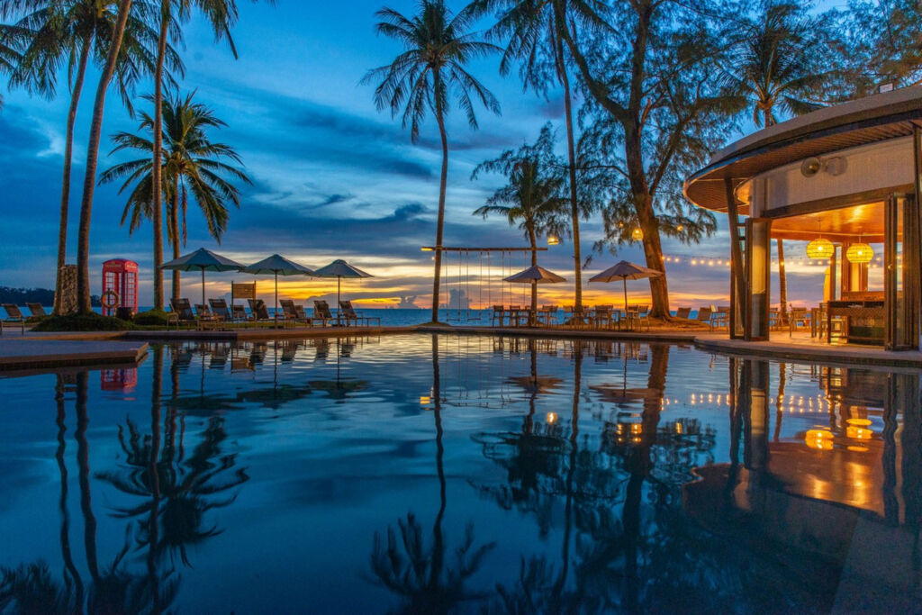 A view over the SAii Koh Samui Choengmon swimming pool at sunset