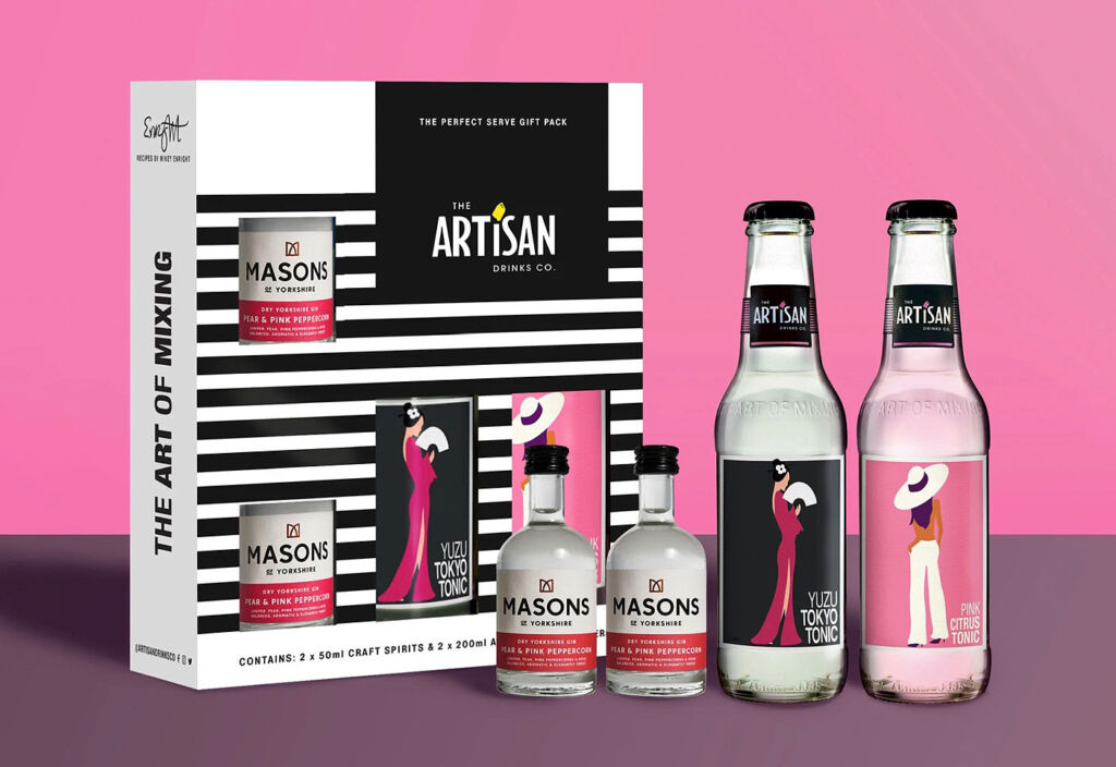 The bright pink gin and tonic set box with bottles in front of it 
