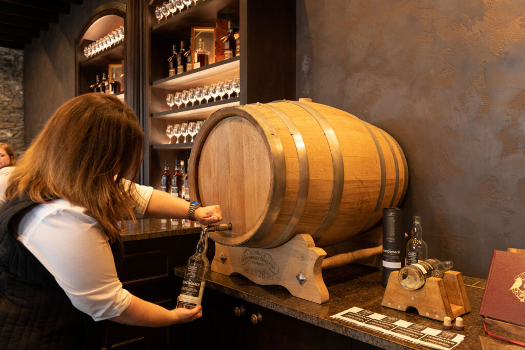 A bottle being filled directly from a barrel