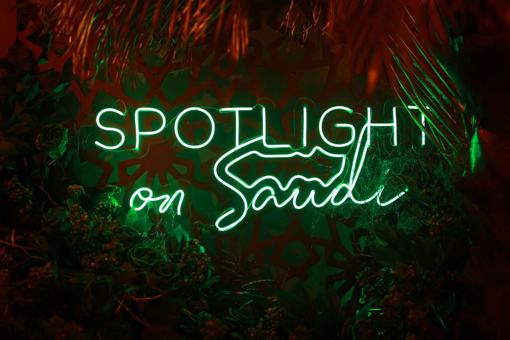 The green neon light spelling out Spotlight on Saudi