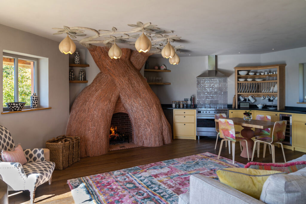 The fireplace which has been designed to resemble tree trunks