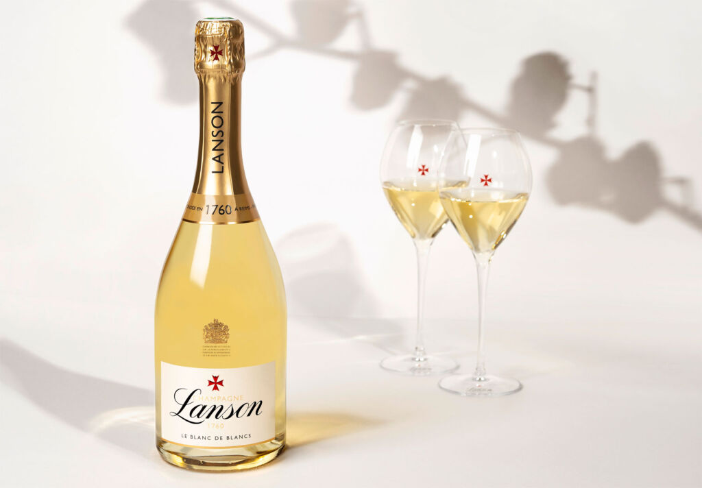 A bottle of Lanson Le Blanc de Blancs next to two filled glasses
