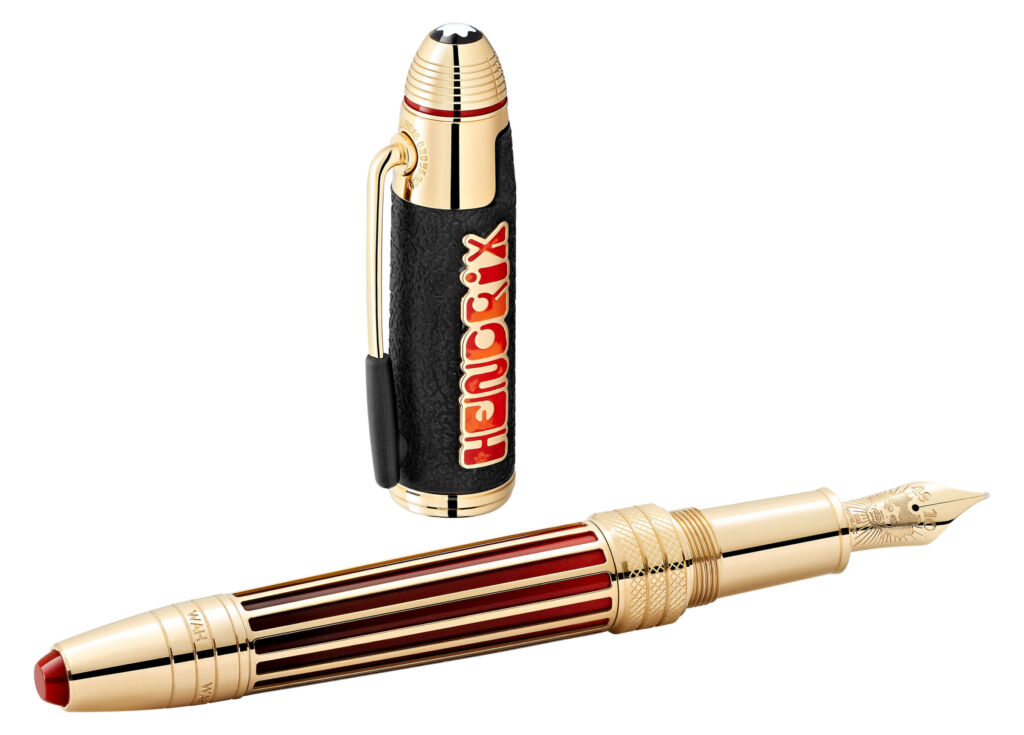 The limited edition 1942 pen in red and gold next to its cap