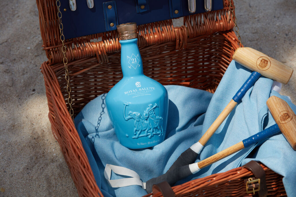 The Royal Salute 21 Year Old Beach Polo edition in a wicker basket with mini polo sticks