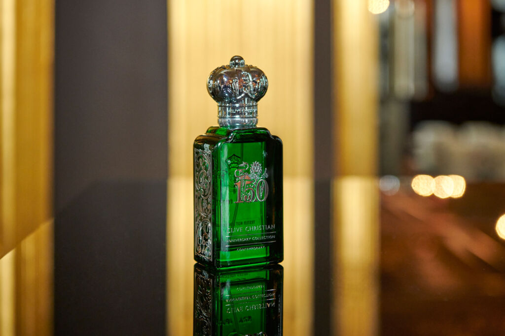 A bottle of the perfume standing on a table