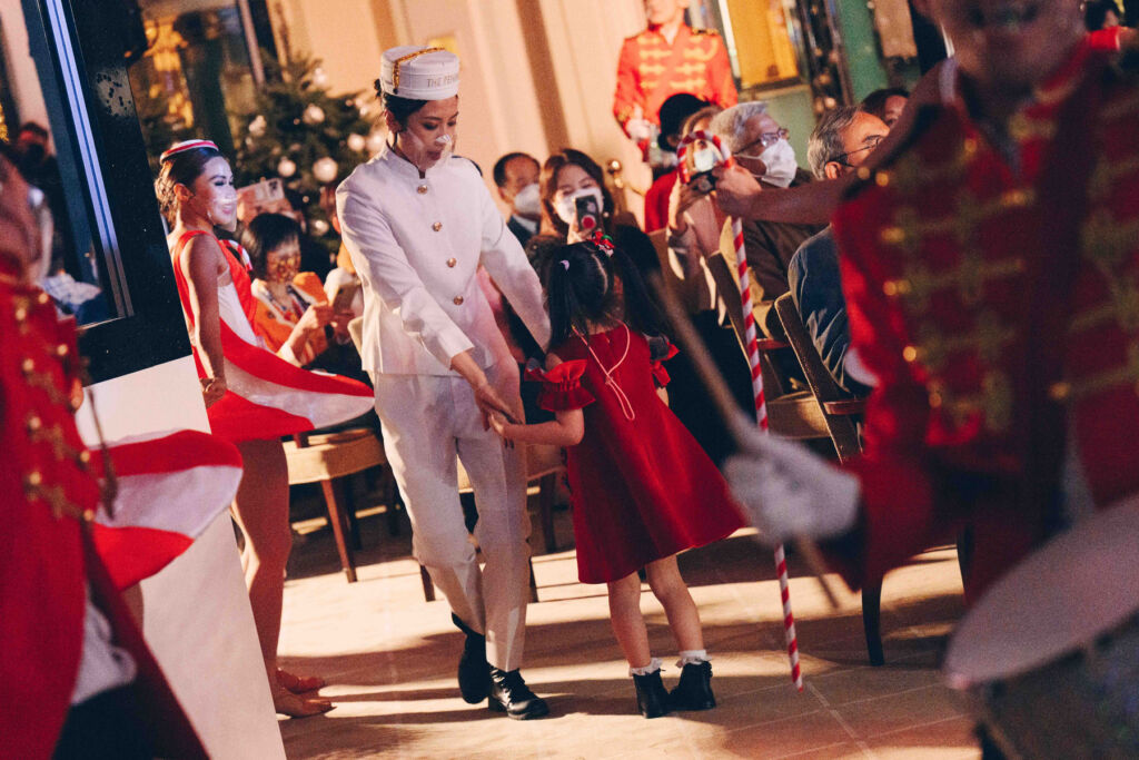 Members of the hotel team dancing with children