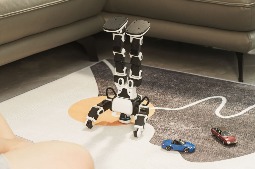 An image showing the robot performing a headstand