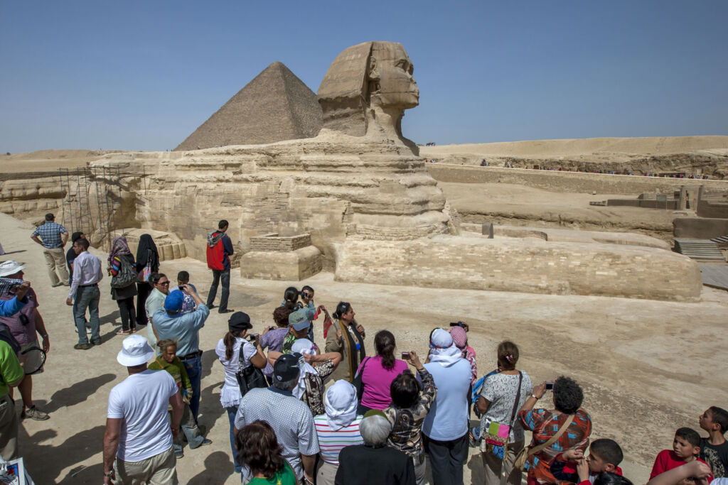 People admiring the Sphinx at the Giza complex