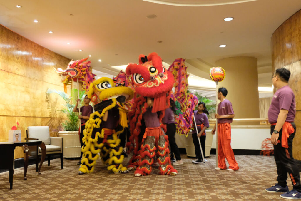 The lion dance performers in the hotel