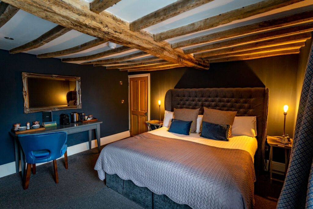 Inside one if the bedroom suites at the Vicarage in Cranage with its wooden beamed ceiling