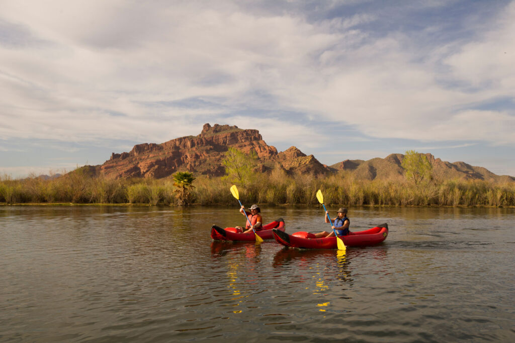 People kayaking on a river in Arizona