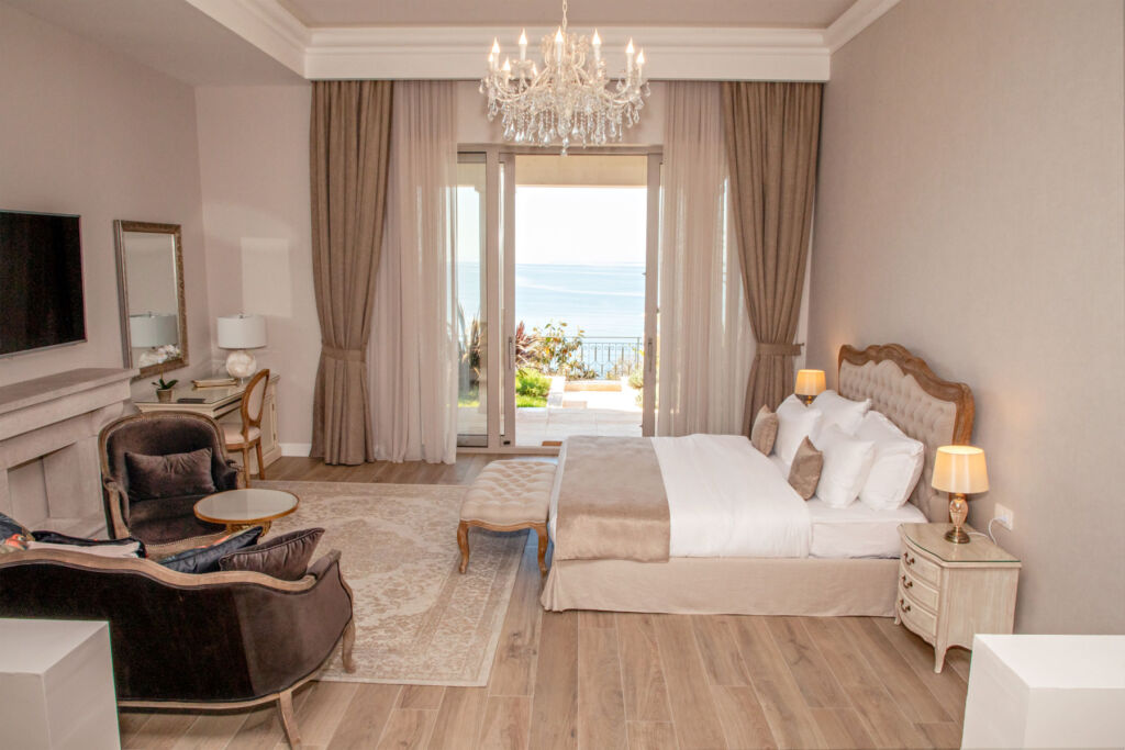 Inside one of the villas luxurious bedroom suites with views out over the sea