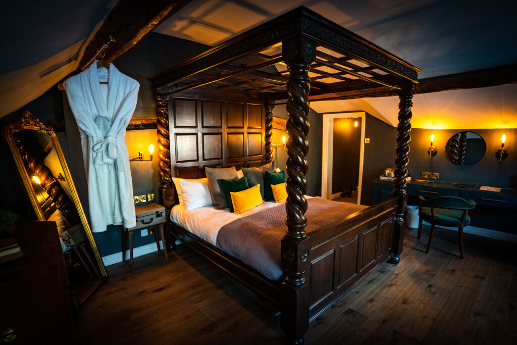 One of the bedroom suites at The Bridge with a four poster bed