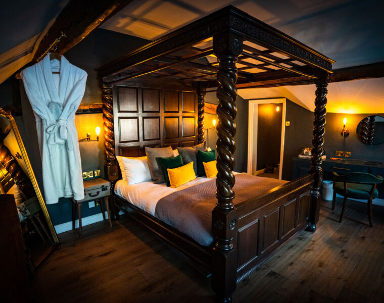 One of the bedroom suites at The Bridge with a four poster bed