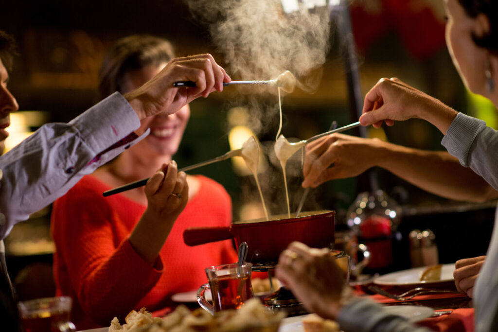 People enjoying a fondue at Bain Bleu