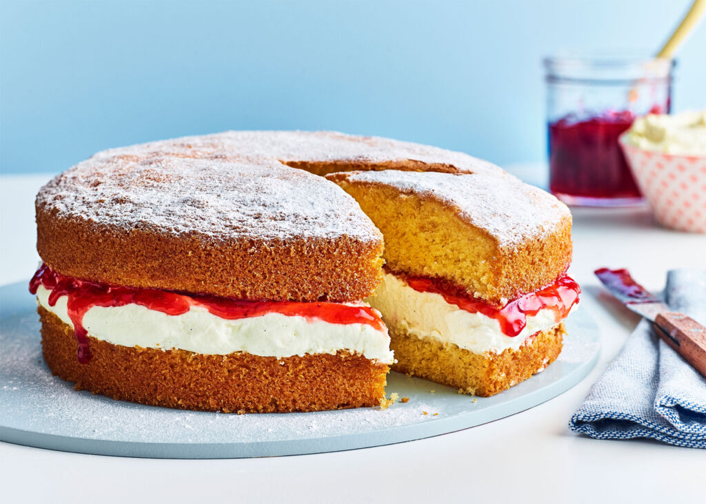 A home baked Victoria Sponge with jam and cream